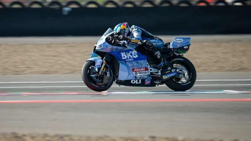 A BK8 Gresini Racing rider on the light blue Ducati with BK8 News on the fairing during the Indonesian Grand Prix at Mandalika