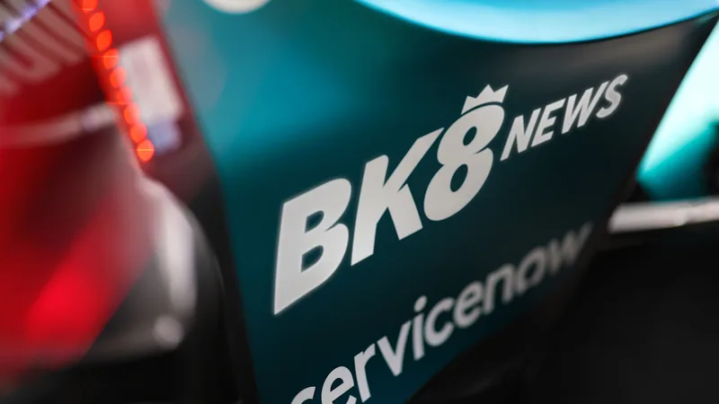 BK8 News logo on the rear wing end plate of the Aston Martin Aramco AMR26 Formula One car